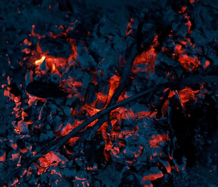 A photo of embers in a fire pit